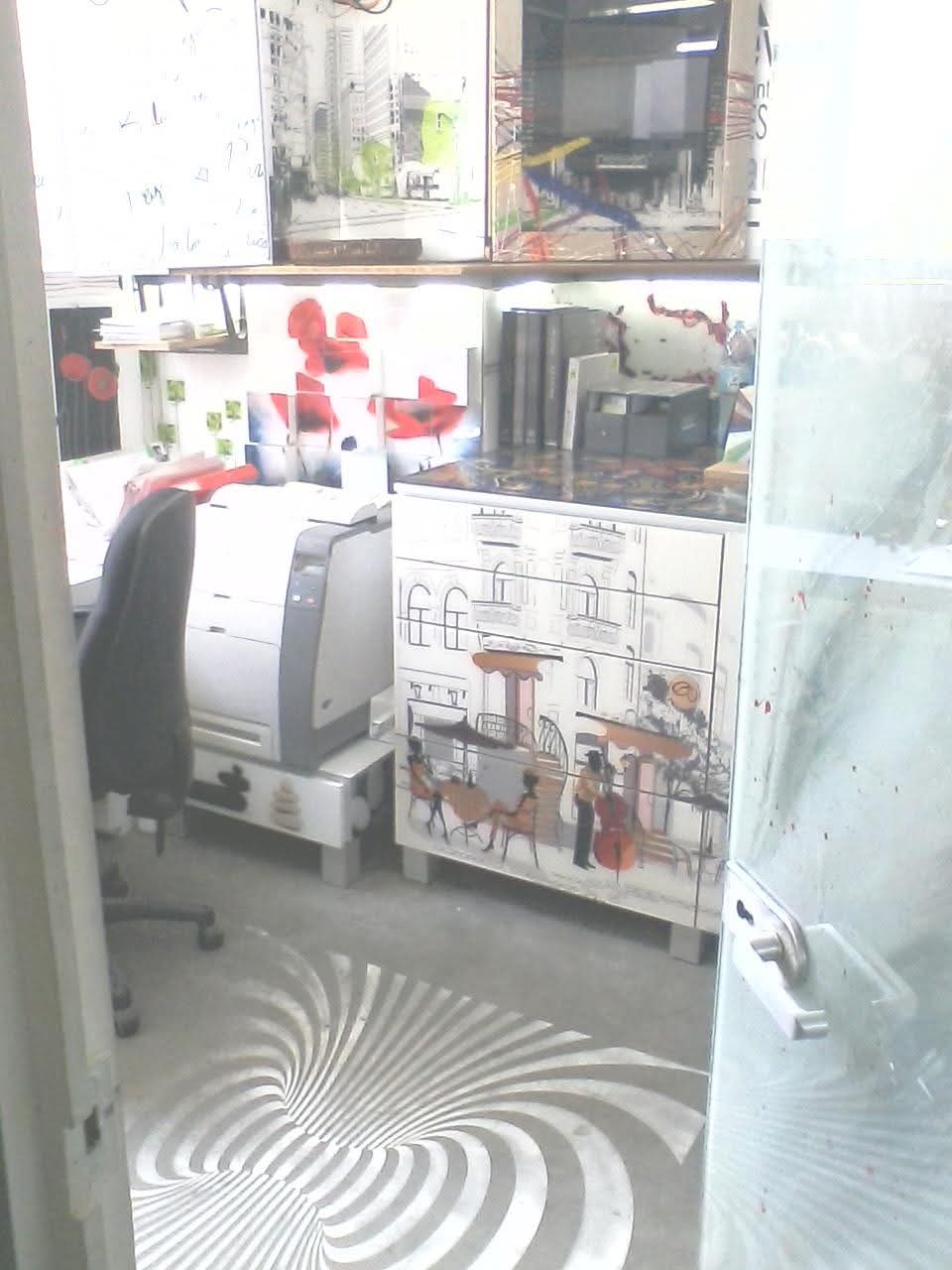 Glass pieces and designs in the workshop office